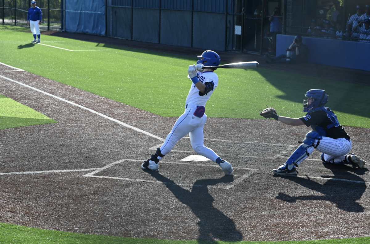 Kai Anderson (10) hits the ball. 